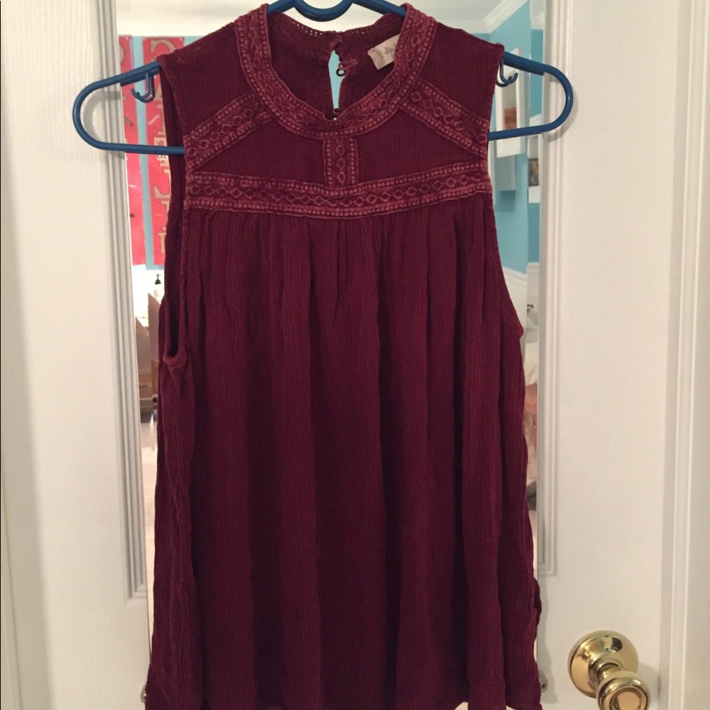 Sleeveless red blouse